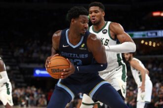 Oct 31, 2024; Memphis, Tennessee, USA; Memphis Grizzlies forward Jaren Jackson Jr. (13) drives to the basket as Milwaukee Bucks forward Giannis Antetokounmpo (34) defends during the second half at FedExForum. Mandatory Credit: Petre Thomas-Imagn Images