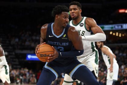 Oct 31, 2024; Memphis, Tennessee, USA; Memphis Grizzlies forward Jaren Jackson Jr. (13) drives to the basket as Milwaukee Bucks forward Giannis Antetokounmpo (34) defends during the second half at FedExForum. Mandatory Credit: Petre Thomas-Imagn Images