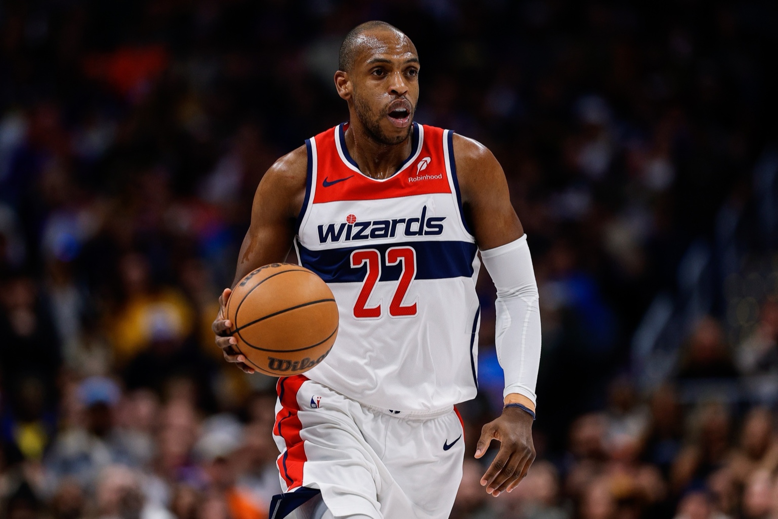 Jan 17, 2026; Denver, Colorado, USA; Washington Wizards forward Khris Middleton (22) dribbles the ball up court in the fourth quarter against the Denver Nuggets at Ball Arena. Mandatory Credit: Isaiah J. Downing-Imagn Images