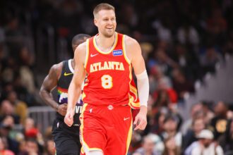 Dec 5, 2025; Atlanta, Georgia, USA; Atlanta Hawks center Kristaps Porzingis (8) reacts after a basket against the Denver Nuggets in the third quarter at State Farm Arena. Mandatory Credit: Brett Davis-Imagn Images