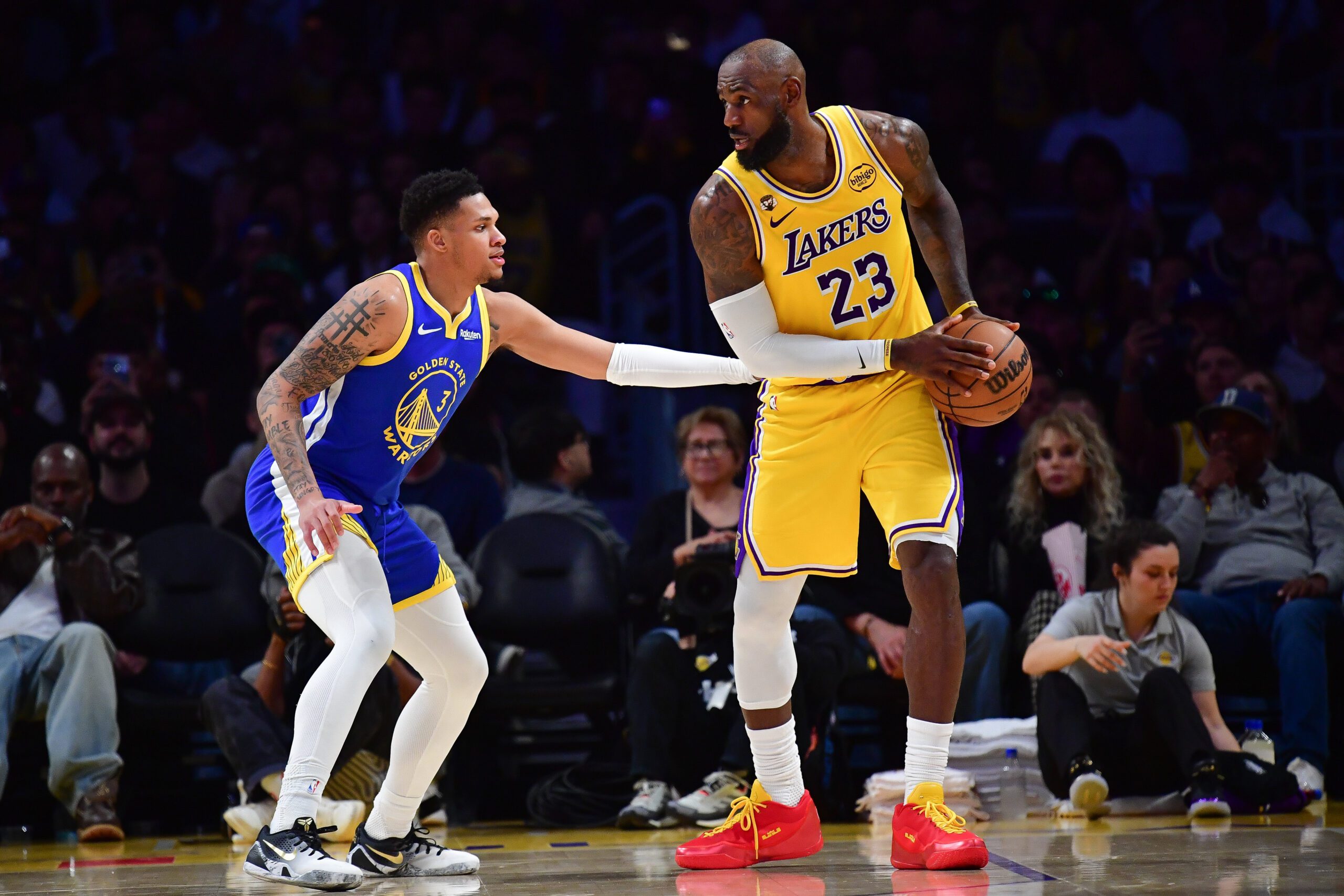 Feb 7, 2026; Los Angeles, California, USA; Los Angeles Lakers forward LeBron James (23) controls the ball against Golden State Warriors guard Will Richard (3) during the second half at Crypto.com Arena. Mandatory Credit: Gary A. Vasquez-Imagn Images
