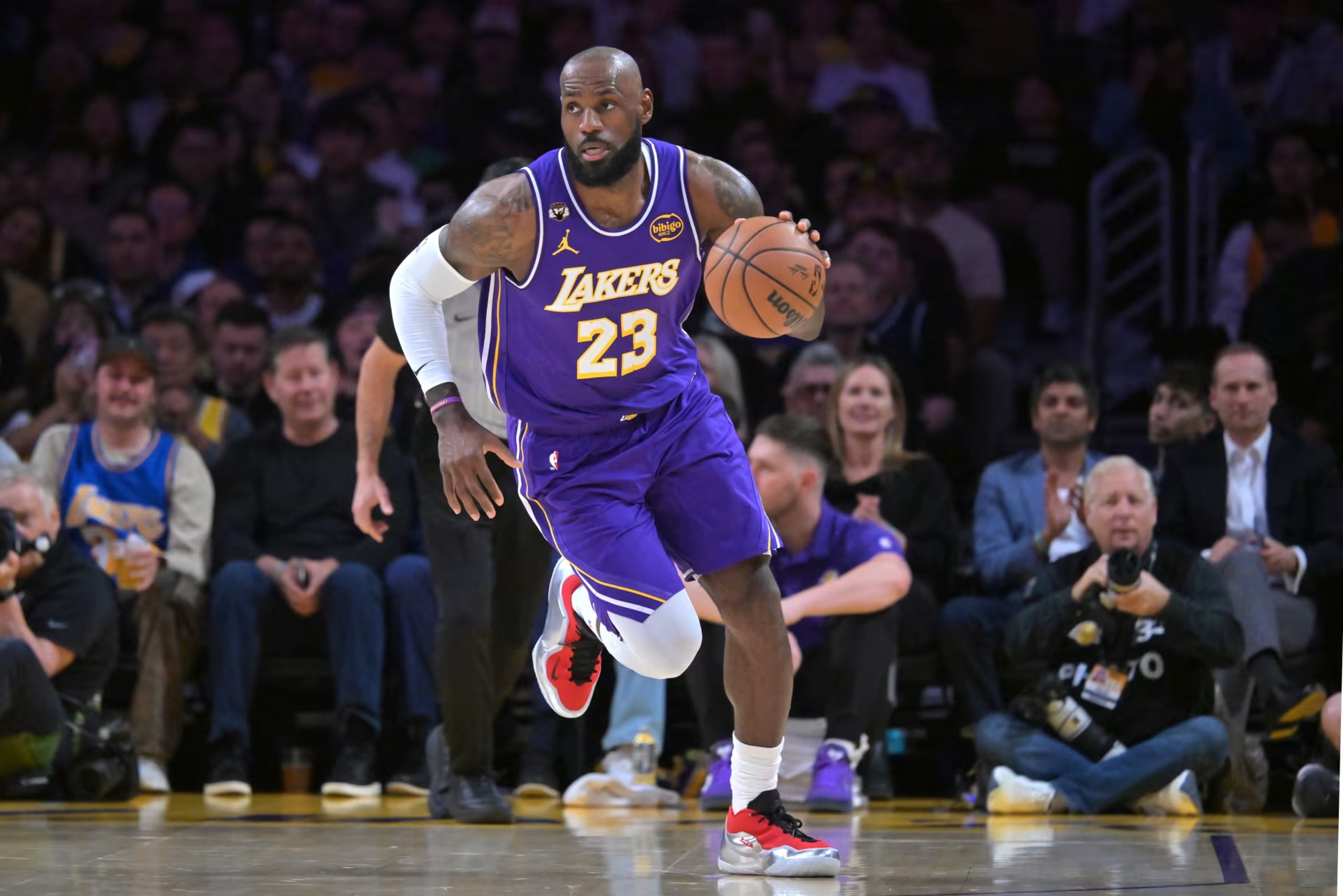 Los Angeles, California, USA; Los Angeles Lakers forward LeBron James (23) handles the ball in the first half against the Dallas Mavericks at Crypto.com Arena. Mandatory Credit: Jayne Kamin-Oncea-Imagn Images