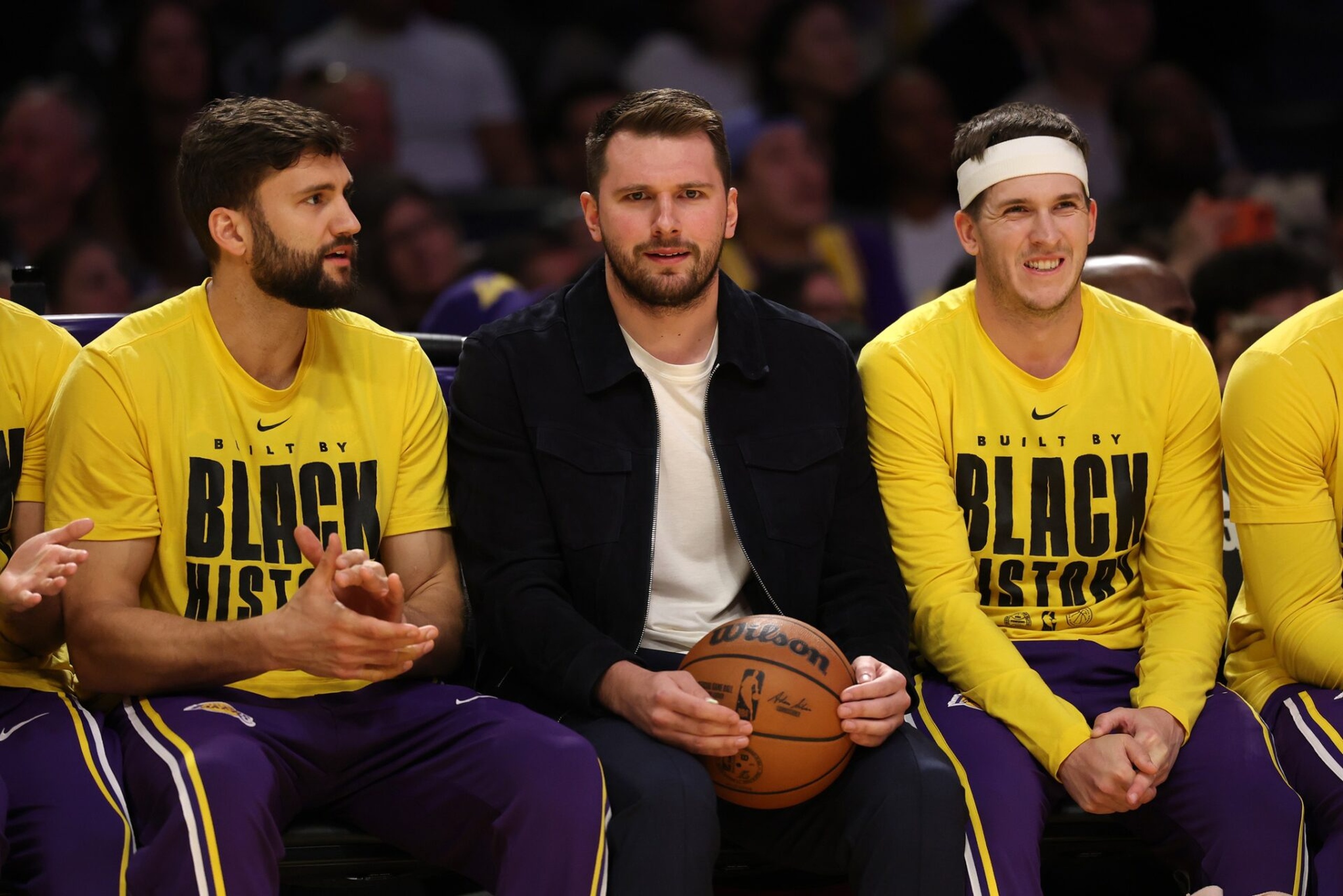 Feb 9, 2026; Los Angeles, California, USA; Los Angeles Lakers guard Luka Doncic (middle) watches a game against the Oklahoma City Thunder at Crypto.com Arena. Mandatory Credit: Kiyoshi Mio-Imagn Images