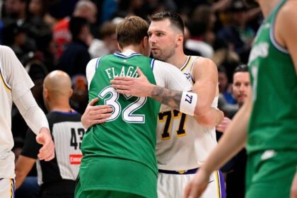 Jan 24, 2026; Dallas, Texas, USA; Los Angeles Lakers guard Luka Doncic (77) hugs Dallas Mavericks forward Cooper Flagg (32) after the game at the American Airlines Center. Mandatory Credit: Jerome Miron-Imagn Images