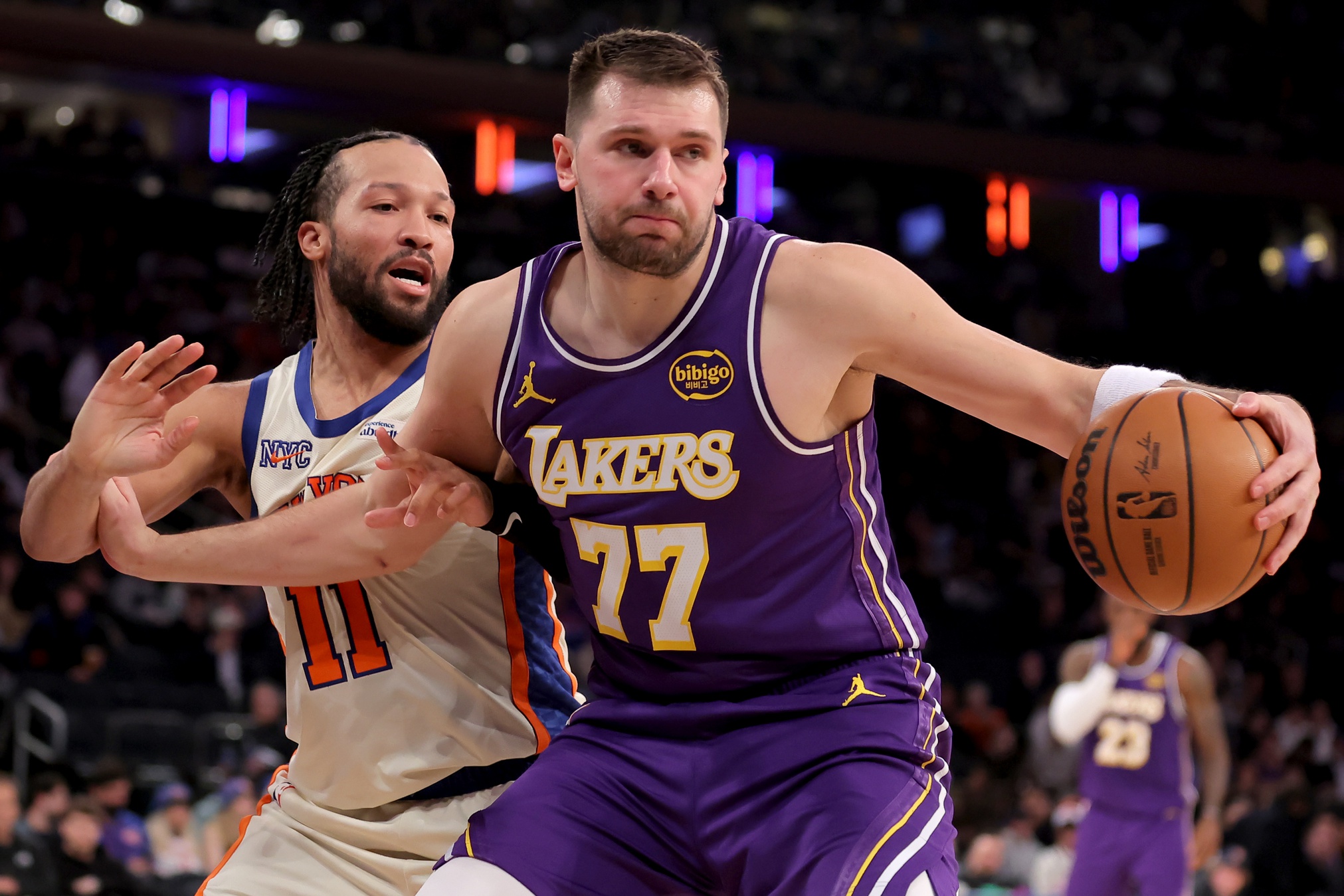 New York, New York, USA; Los Angeles Lakers guard Luka Doncic (77) controls the ball against New York Knicks guard Jalen Brunson (11) during the third quarter at Madison Square Garden. Mandatory Credit: Brad Penner-Imagn Images