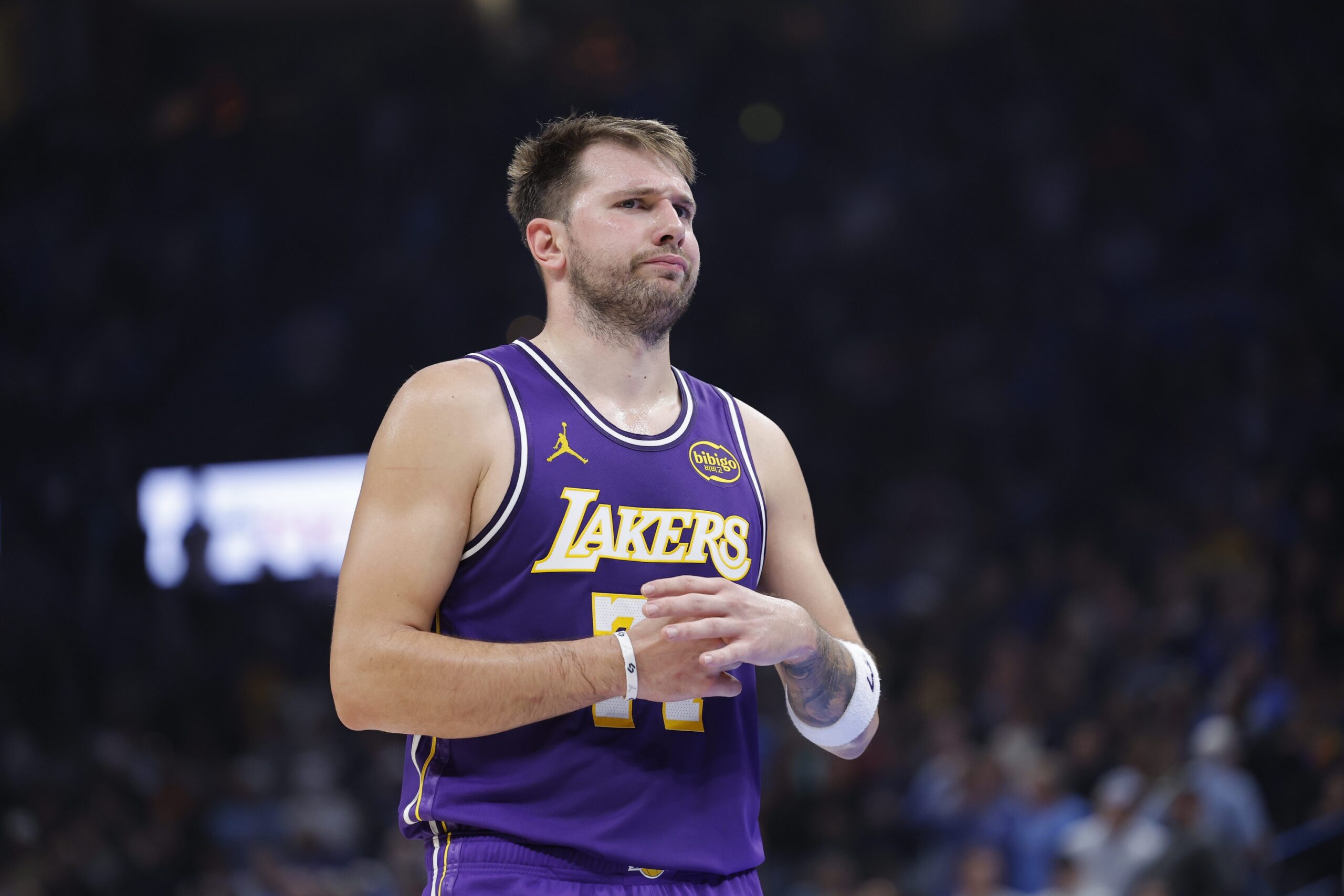 Nov 12, 2025; Oklahoma City, Oklahoma, USA; Los Angeles Lakers guard Luka Doncic reacts to a fan during the second quarter of a game against the Oklahoma City Thunder at Paycom Center. Mandatory Credit: Alonzo Adams-Imagn Images