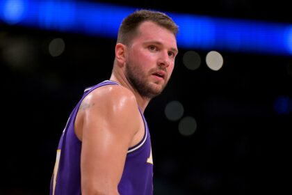 Los Angeles, California, USA; Los Angeles Lakers guard Luka Doncic (77) looks on in the first half against the Philadelphia 76ers at Crypto.com Arena. Mandatory Credit: Jayne Kamin-Oncea-Imagn Images