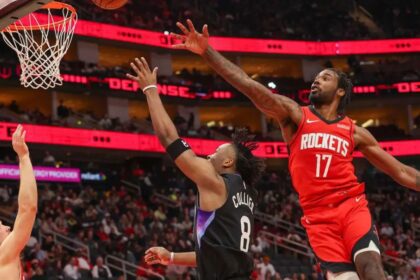 Feb 23, 2026; Houston, Texas, USA; Utah Jazz guard Isaiah Collier (8) shoots against Houston Rockets forward Tari Eason (17) in the second quarter at Toyota Center. Mandatory Credit: Thomas Shea-Imagn Images