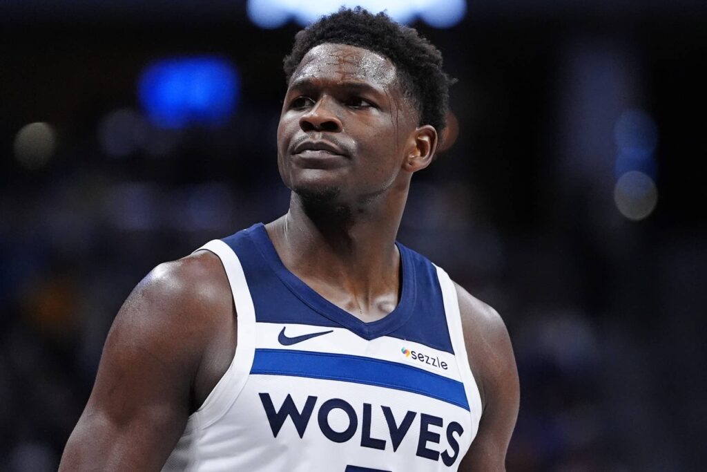 Denver, Colorado, USA; Minnesota Timberwolves guard Anthony Edwards (5) reacts against the Denver Nuggets during the first half at Ball Arena. Mandatory Credit: Ron Chenoy-Imagn Images