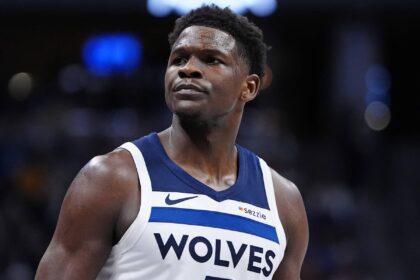 Denver, Colorado, USA; Minnesota Timberwolves guard Anthony Edwards (5) reacts against the Denver Nuggets during the first half at Ball Arena. Mandatory Credit: Ron Chenoy-Imagn Images