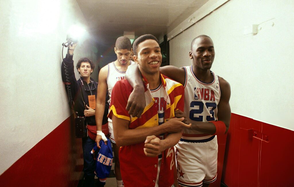 CHICAGO - FEBRUARY 7: Michael Jordan #23 of the Chicago Bulls congratulates Glenn (Doc) Rivers after winning the 1988 All-Star game on February 7, 1988 in Chicago, Illinois. Mandatory copyright notice: Copyright NBAE 2002 (Photo by Walter Iooss Jr./ NBAE/ Getty Images)