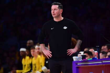 Los Angeles, California, USA; Los Angeles Lakers head coach JJ Redick watches game action against the Golden State Warriors during the first half at Crypto.com Arena. Mandatory Credit: Gary A. Vasquez-Imagn Images