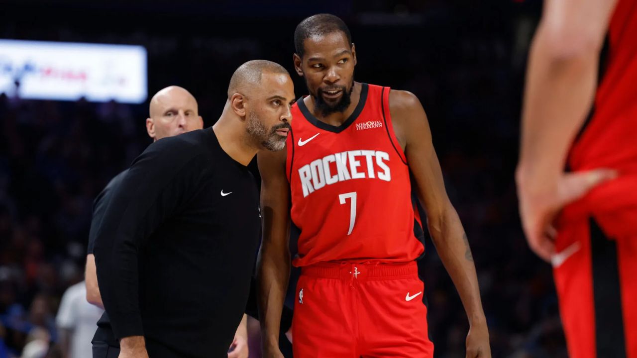 Houston Rockets head coach Ime Udoka talks to forward Kevin Durant (7) during a break in play against the Oklahoma City Thunder during the second half at Paycom Center. Mandatory Credit: Alonzo Adams-Imagn Images