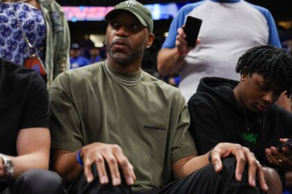 Orlando, Florida, USA; Orlando Magic former guard Tracy McGrady looks on from the sidelines during a game against the Cleveland Cavaliers in the fourth quarter during game four of the first round for the 2024 NBA playoffs at Kia Center. Mandatory Credit: Nathan Ray Seebeck-Imagn Images
