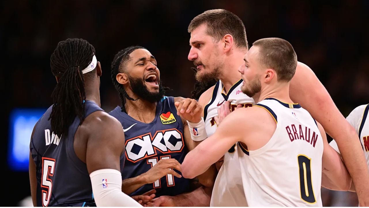 OKLAHOMA CITY, OKLAHOMA - FEBRUARY 27: Isaiah Joe #11 of the Oklahoma City Thunder gets in between Luguentz Dort #5 of the Oklahoma City Thunder and Nikola Jokic #15 of the Denver Nuggets during the second half at Paycom Center on February 27, 2026 in Oklahoma City, Oklahoma. (Photo by Joshua Gateley/Getty Images)