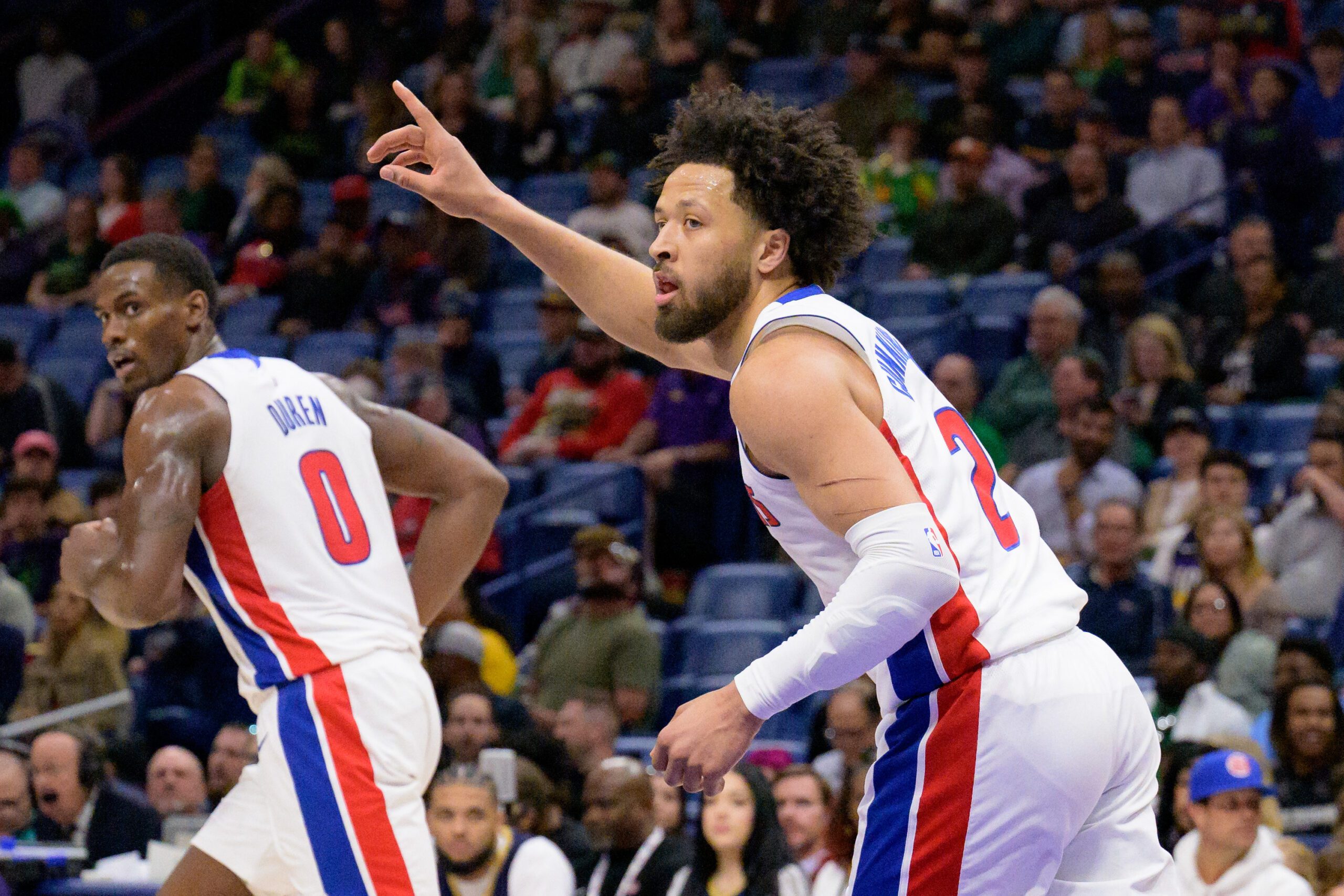 Detroit Pistons guard Cade Cunningham (2) reacts after a score next to center Jalen Duren (0) during the first half against the New Orleans Pelicans at Smoothie King Center. Mandatory Credit: Matthew Hinton-Imagn Images