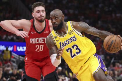 Apr 24, 2026; Houston, Texas, USA; Los Angeles Lakers forward LeBron James (23) drives with the ball as Houston Rockets center Alperen Sengun (28) defends during the fourth quarter during game three of the first round of the 2026 NBA Playoffs at Toyota Center. Mandatory Credit: Troy Taormina-Imagn Images