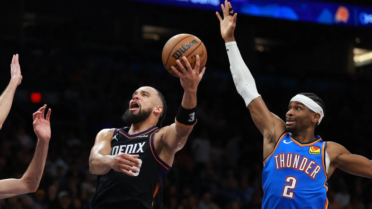Jan 4, 2026; Phoenix, Arizona, USA; Phoenix Suns forward Dillon Brooks (3) drives to the basket against Oklahoma City Thunder guard Shai Gilgeous-Alexander (2) at Mortgage Matchup Center. Mandatory Credit: Mark J. Rebilas-Imagn Images