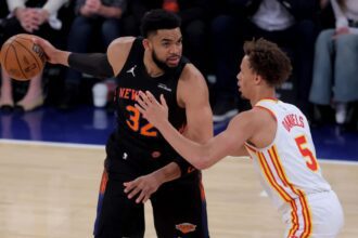 Apr 28, 2026; New York, New York, USA; New York Knicks center Karl-Anthony Towns (32) controls the ball against Atlanta Hawks guard Dyson Daniels (5) during the first quarter of game five of the first round of the 2026 NBA Playoffs at Madison Square Garden. Mandatory Credit: Brad Penner-Imagn Images