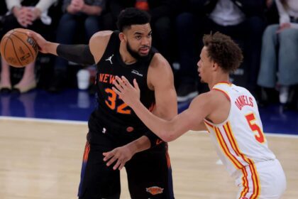 Apr 28, 2026; New York, New York, USA; New York Knicks center Karl-Anthony Towns (32) controls the ball against Atlanta Hawks guard Dyson Daniels (5) during the first quarter of game five of the first round of the 2026 NBA Playoffs at Madison Square Garden. Mandatory Credit: Brad Penner-Imagn Images