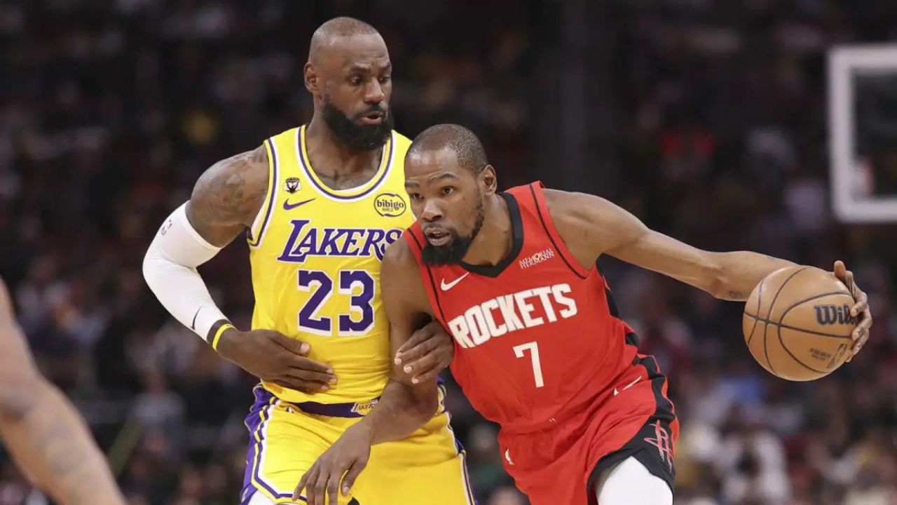 Mar 16, 2026; Houston, Texas, USA; Houston Rockets forward Kevin Durant (7) dribbles the ball as Los Angeles Lakers forward LeBron James (23) defends during the first quarter at Toyota Center. Mandatory Credit: Troy Taormina-Imagn Images