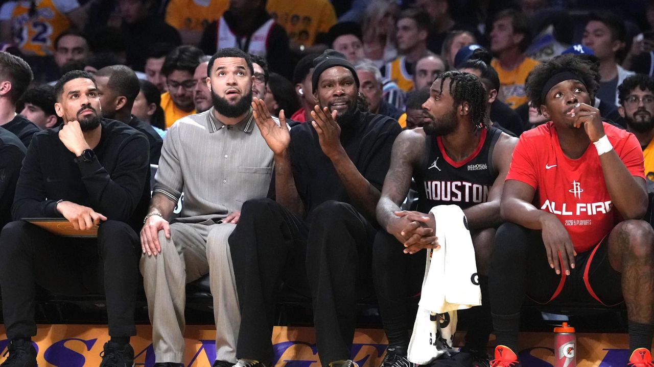Apr 18, 2026; Los Angeles, California, USA; Houston Rockets forward Kevin Durant (center) watches from the bench against the Los Angeles Lakers in the first half during game one of the first round of the 2026 NBA Playoffs at Crypto.com Arena. Mandatory Credit: Kirby Lee-Imagn Images