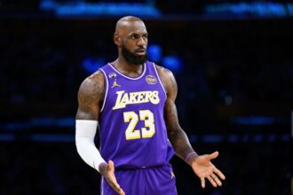 Los Angeles, California, USA; Los Angeles Lakers forward LeBron James (23) reacts during the first half against the Brooklyn Nets at Crypto.com Arena. Mandatory Credit: William Liang-Imagn Images