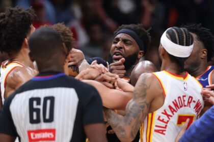 ATLANTA, GEORGIA - APRIL 30: Mitchell Robinson #23 of the New York Knicks and Jalen Johnson #1 of the Atlanta Hawks fight during the second quarter in Game Six of the First Round of the NBA Eastern Conference Playoffs at State Farm Arena on April 30, 2026 in Atlanta, Georgia. (Photo by Kevin C. Cox/Getty Images) (Kevin C. Cox via Getty Images)