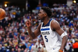 Apr 20, 2026; Denver, Colorado, USA; Minnesota Timberwolves guard Anthony Edwards (5) calls for a replay in the first half against the Denver Nuggets during game two of the first round of the 2026 NBA Playoffs at Ball Arena. Mandatory Credit: Ron Chenoy-Imagn Images