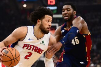May 11, 2026; Cleveland, Ohio, USA; Detroit Pistons guard Cade Cunningham (2) drives to the basket against Cleveland Cavaliers guard Donovan Mitchell (45) during the first half of game four in the second round of the 2026 NBA Playoffs at Rocket Arena. Mandatory Credit: Ken Blaze-Imagn Images