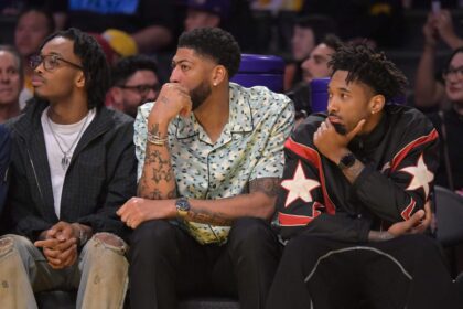 Mar 30, 2026; Los Angeles, California, USA; Washington Wizards forward Anthony Davis (23), center, looks on from the bench during the first half against the Los Angeles Lakers at Crypto.com Arena. Mandatory Credit: Jayne Kamin-Oncea-Imagn Images