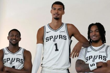 Sep 29, 2025; San Antonio, TX, USA; San Antonio Spurs forward-center Victor Wembanyama (1) along with guards De’Aaron Fox (4) and Stephon Castle (5) pose for photos during Media Day at Victory Capital Performance Center in San Antonio. Mandatory Credit: Scott Wachter-Imagn Images
