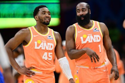 Cleveland Cavaliers guard Donovan Mitchell (45) and guard James Harden (1) talk during a free throw attempt during the second half against the Orlando Magic at Rocket Arena. Credit: David Dermer-Imagn Images