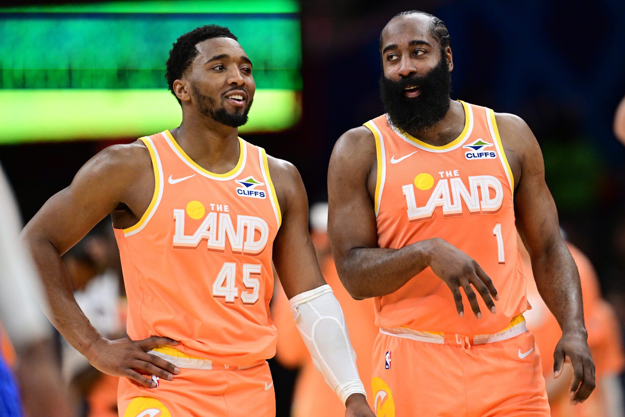 Cleveland Cavaliers guard Donovan Mitchell (45) and guard James Harden (1) talk during a free throw attempt during the second half against the Orlando Magic at Rocket Arena. Credit: David Dermer-Imagn Images