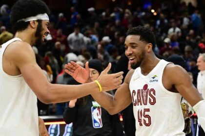Jan 8, 2025; Cleveland, Ohio, USA; Cleveland Cavaliers guard Donovan Mitchell (45) celebrates with center Jarrett Allen (31) after the Cavaliers beat the Oklahoma City Thunder at Rocket Mortgage FieldHouse. Mandatory Credit: Ken Blaze-Imagn Images