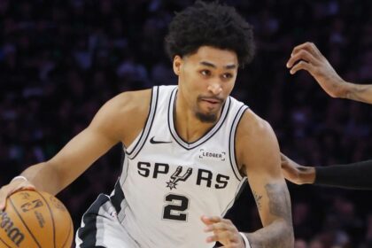 May 10, 2026; Minneapolis, Minnesota, USA; San Antonio Spurs guard Dylan Harper (2) works around Minnesota Timberwolves forward Jaden McDaniels (3) in the first quarter of game four of the second round of the 2026 NBA Playoffs at Target Center. Mandatory Credit: Bruce Kluckhohn-Imagn Images