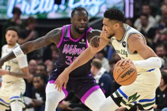 Milwaukee Bucks forward Giannis Antetokounmpo (34) drives for the basket against Minnesota Timberwolves forward Julius Randle (30) in the first quarter at Fiserv Forum.