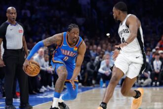 Jan 13, 2026; Oklahoma City, Oklahoma, USA; Oklahoma City Thunder guard/forward Jalen Williams (8) drives down the court beside San Antonio Spurs guard De'aaron Fox (4) during the second half at Paycom Center. Mandatory Credit: Alonzo Adams-Imagn Images