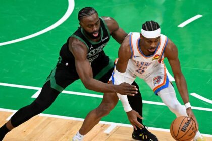 BOSTON, MASSACHUSETTS - MARCH 12: Jaylen Brown #7 of the Boston Celtics defends Shai Gilgeous-Alexander #2 of the Oklahoma City Thunder during the second quarter at the TD Garden on March 12, 2025 in Boston, Massachusetts. (Photo by Brian Fluharty/Getty Images)