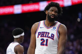May 10, 2026; Philadelphia, Pennsylvania, USA; Philadelphia 76ers center Joel Embiid (21) reacts against the New York Knicks in the second quarter during game four of the second round of the 2026 NBA Playoffs at Xfinity Mobile Arena. Mandatory Credit: Kyle Ross-Imagn Images