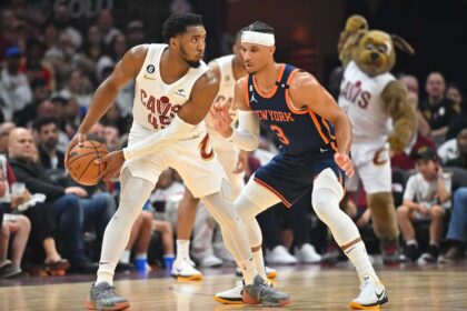 CLEVELAND, OHIO - APRIL 15: Donovan Mitchell #45 of the Cleveland Cavaliers posts up against Josh Hart #3 of the New York Knicks during the second quarter of Game One of the Eastern Conference First Round Playoffs at Rocket Mortgage Fieldhouse on April 15, 2023 in Cleveland, Ohio. (Photo by Jason Miller/Getty Images)