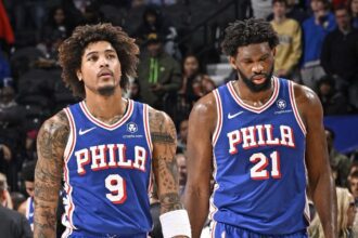 PHILADELPHIA, PA - DECEMBER 18: Kelly Oubre Jr. #9 and Joel Embiid #21 of the Philadelphia 76ers of the Philadelphia 76ers look on during the game against the Chicago Bulls on December 18, 2023 at the Wells Fargo Center in Philadelphia, Pennsylvania (Photo by David Dow/NBAE via Getty Images)