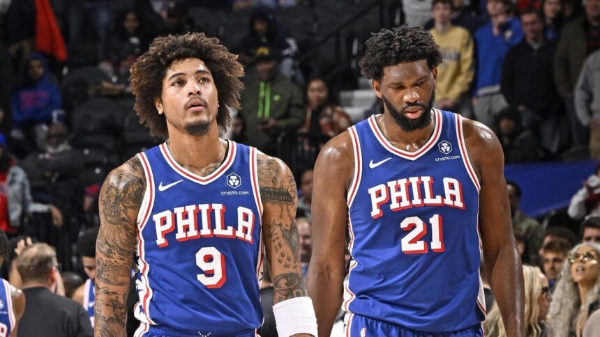 PHILADELPHIA, PA - DECEMBER 18: Kelly Oubre Jr. #9 and Joel Embiid #21 of the Philadelphia 76ers of the Philadelphia 76ers look on during the game against the Chicago Bulls on December 18, 2023 at the Wells Fargo Center in Philadelphia, Pennsylvania (Photo by David Dow/NBAE via Getty Images)