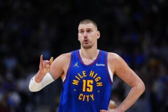 Apr 20, 2026; Denver, Colorado, USA; Denver Nuggets center Nikola Jokic (15) reacts towards the bench in the second half against the Minnesota Timberwolves during game two of the first round of the 2026 NBA Playoffs at Ball Arena. Mandatory Credit: Ron Chenoy-Imagn Images