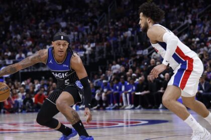Apr 29, 2026; Detroit, Michigan, USA; Orlando Magic forward Paolo Banchero (5) dribbles defended by Detroit Pistons guard Cade Cunningham (2) in the first half during game five of the first round of the 2026 NBA Playoffs at Little Caesars Arena. Mandatory Credit: Rick Osentoski-Imagn Images