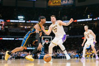 OKLAHOMA CITY, OKLAHOMA - APRIL 6: Shai Gilgeous-Alexander #2 of the Oklahoma City Thunder drives to the basket around Luka Doncic #77 of the Los Angeles Lakers during the second quarter at Paycom Center on April 6, 2025 in Oklahoma City, Oklahoma.(Photo by William Purnell/Getty Images)