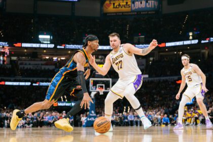OKLAHOMA CITY, OKLAHOMA - APRIL 6: Shai Gilgeous-Alexander #2 of the Oklahoma City Thunder drives to the basket around Luka Doncic #77 of the Los Angeles Lakers during the second quarter at Paycom Center on April 6, 2025 in Oklahoma City, Oklahoma.(Photo by William Purnell/Getty Images)