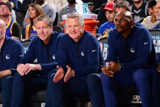 Steve Kerr sits amid the Warriors' assistant coaching staff. Mandatory Credit: Adam Pantozzi/NBAE via Getty Images