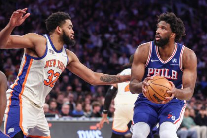 Philadelphia 76ers center Joel Embiid (21) looks to shoot past New York Knicks center Karl-Anthony Towns (32) in the third quarter at Madison Square Garden.