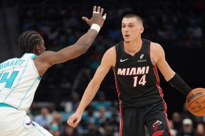 Apr 14, 2026; Charlotte, North Carolina, USA; Miami Heat guard Tyler Herro (14) handles the ball against Charlotte Hornets forward Moussa Diabaté (14) during the second quarter during the play-in rounds between the Charlotte Hornets and the Miami Heat of the 2026 NBA Playoffs at Spectrum Center. Mandatory Credit: Jim Dedmon-Imagn Images